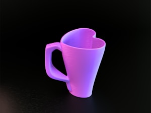 A purple cup sitting on top of a table