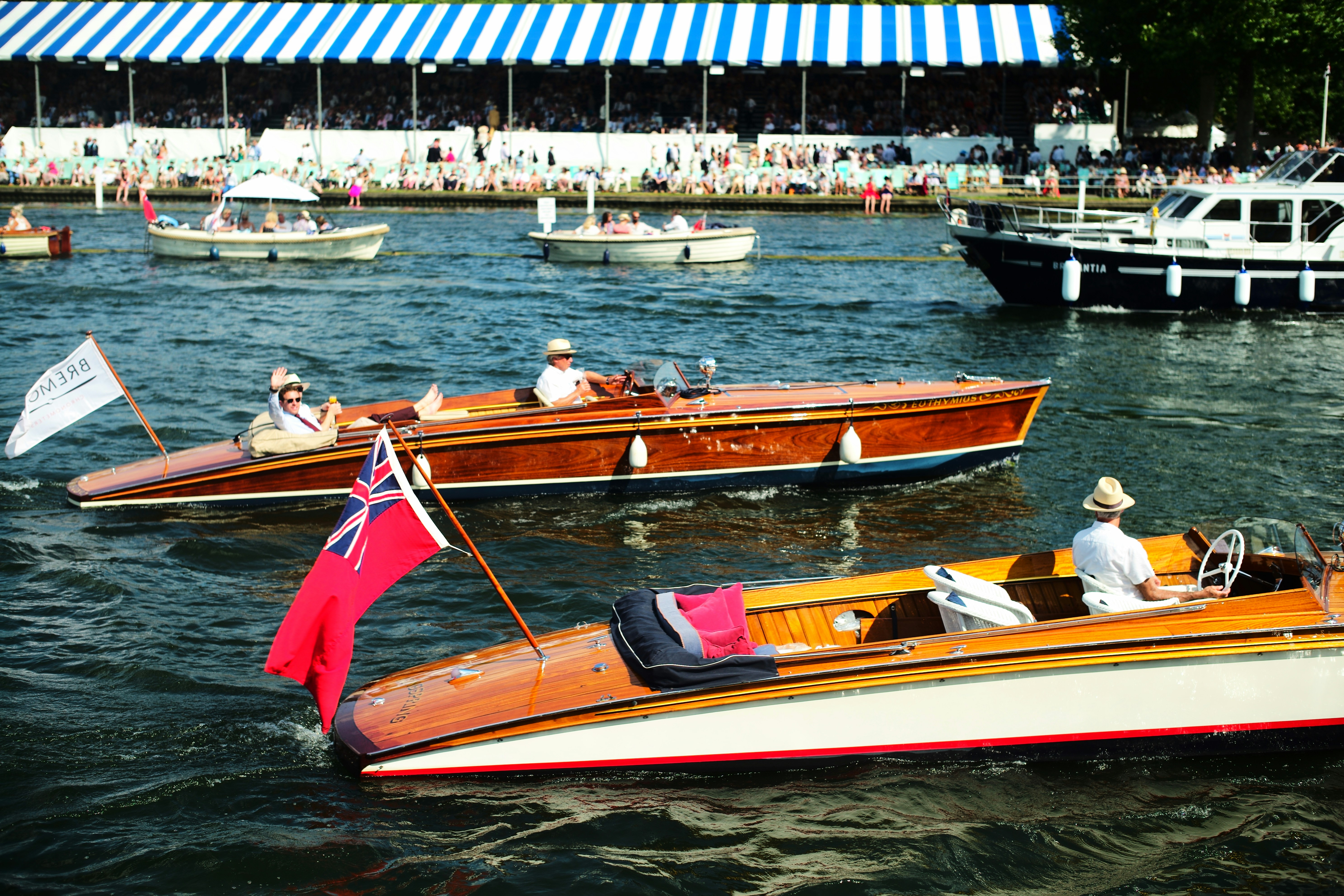 A group of boats floating on top of a body of water