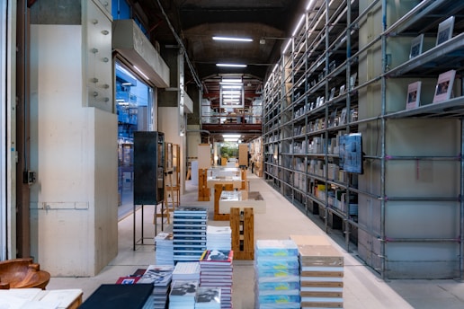 A room filled with lots of shelves filled with books