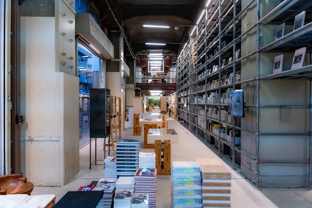 A room filled with lots of shelves filled with books