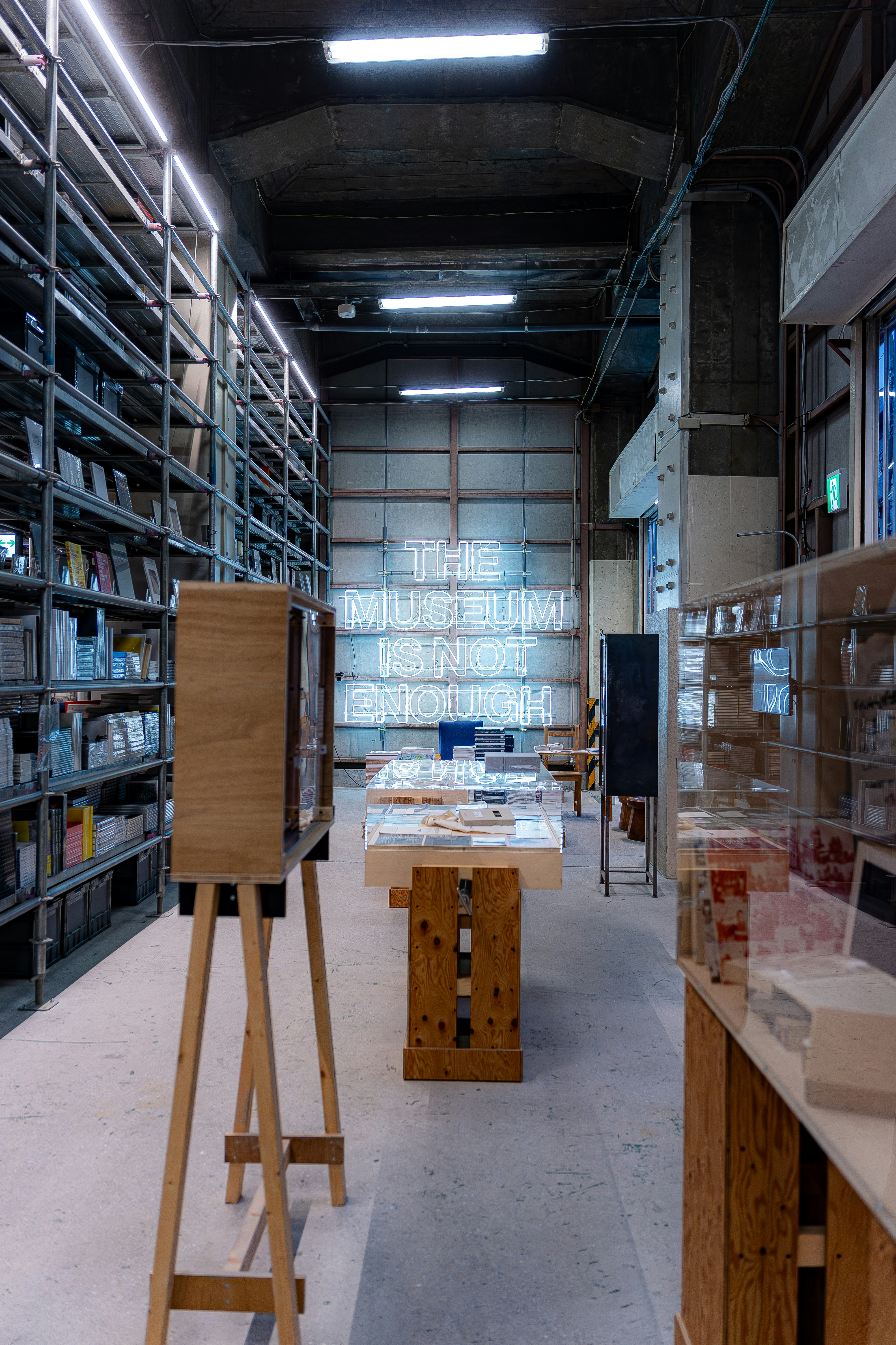 A room filled with lots of shelves filled with books