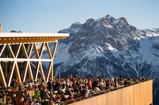 A crowd of people standing on top of a tall building