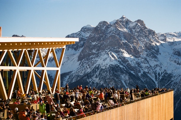 A crowd of people standing on top of a tall building