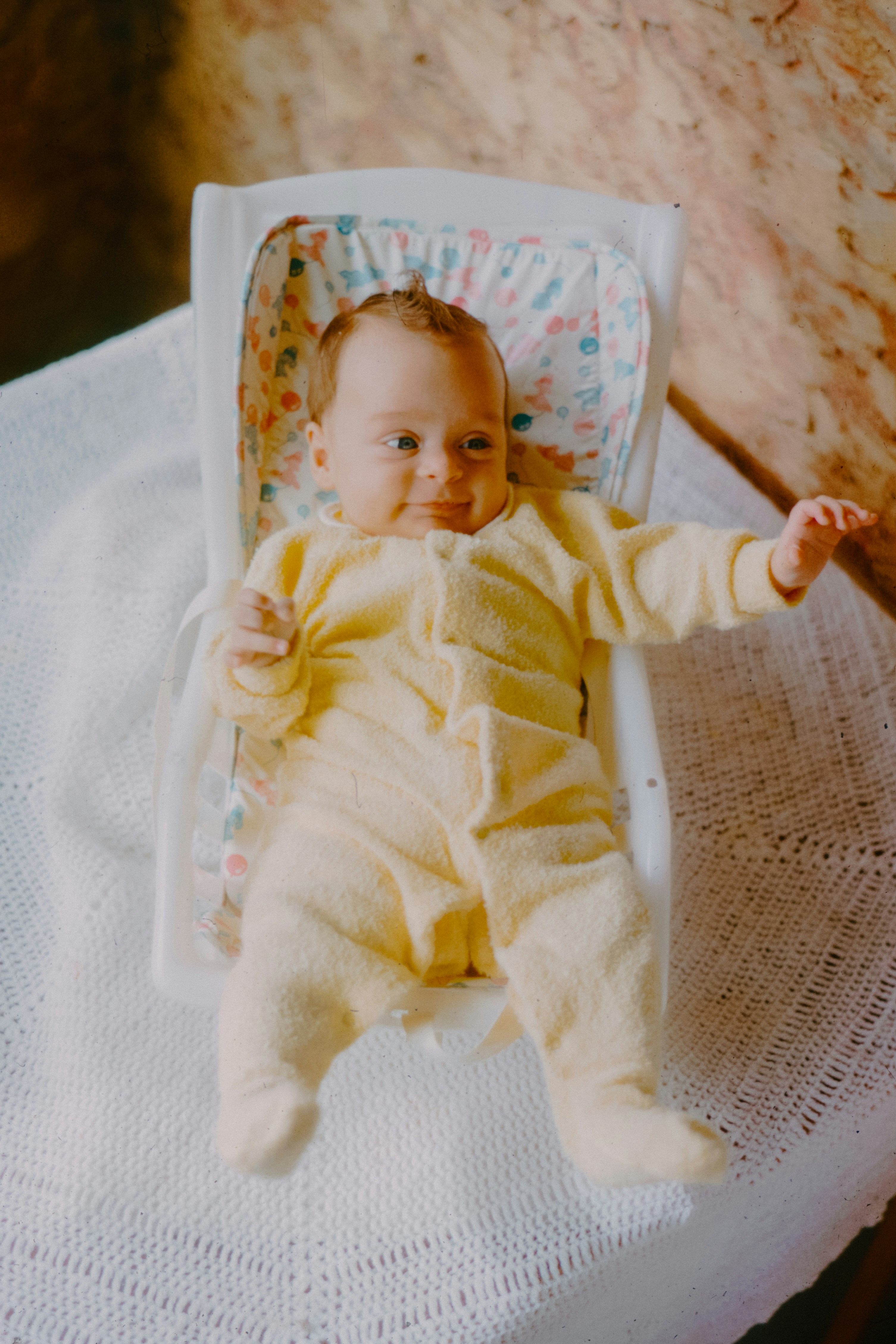 Baby in a two-piece football suit