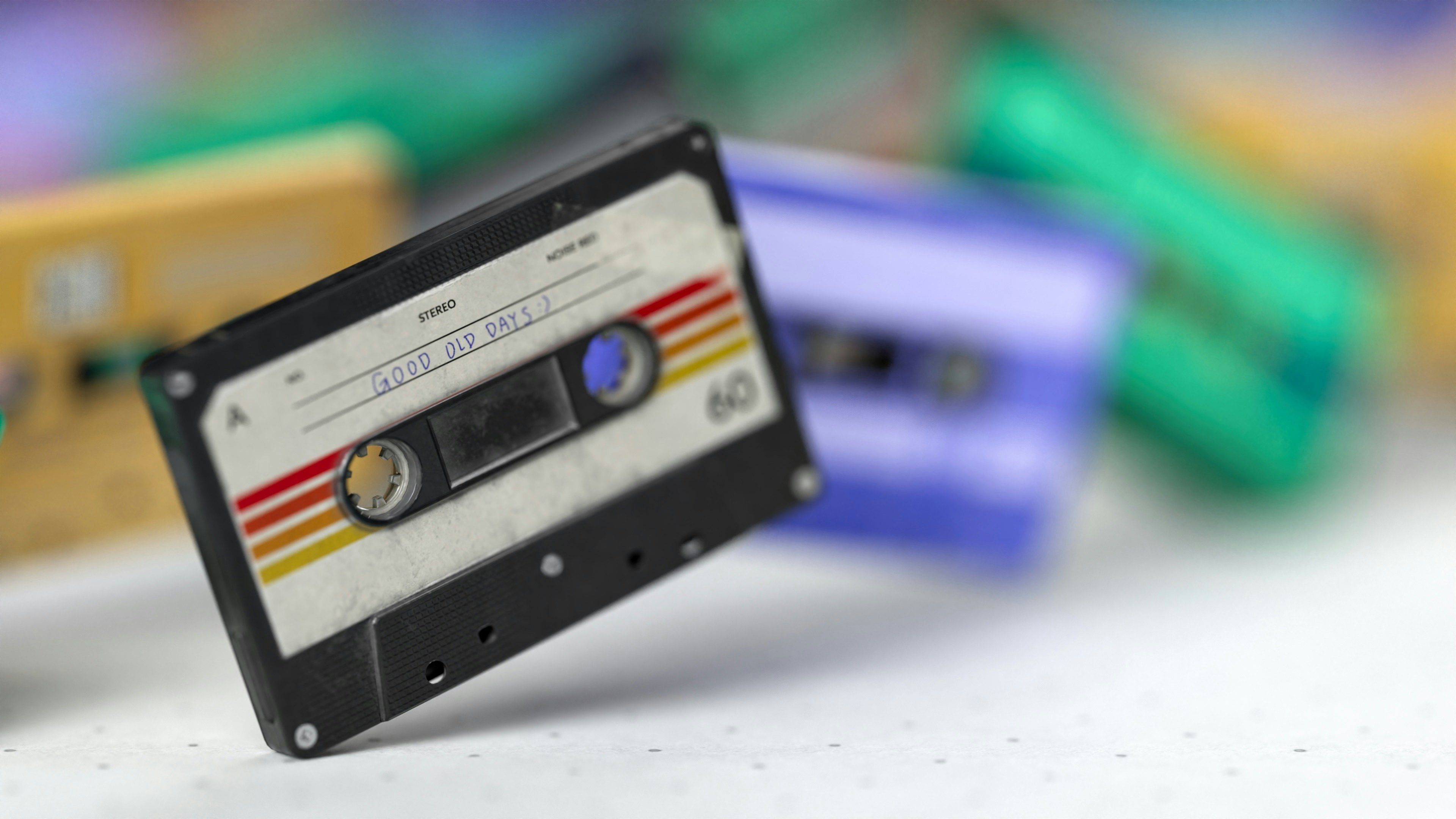 Multicolor cassette tapes. The tape at the forefront is labeled "Good Old Days."