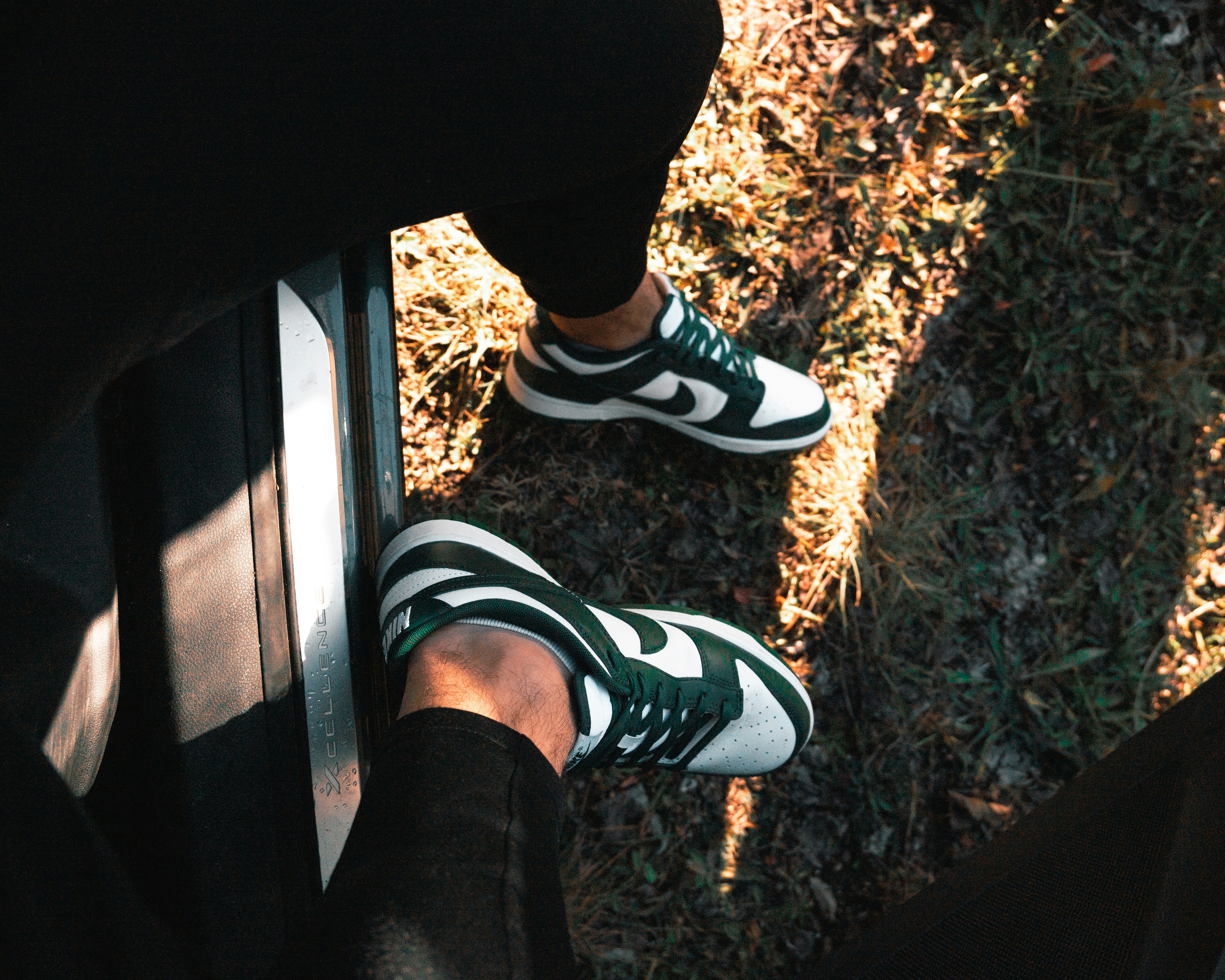 A person wearing green and white shoes standing next to each other, Saturday sunset walk