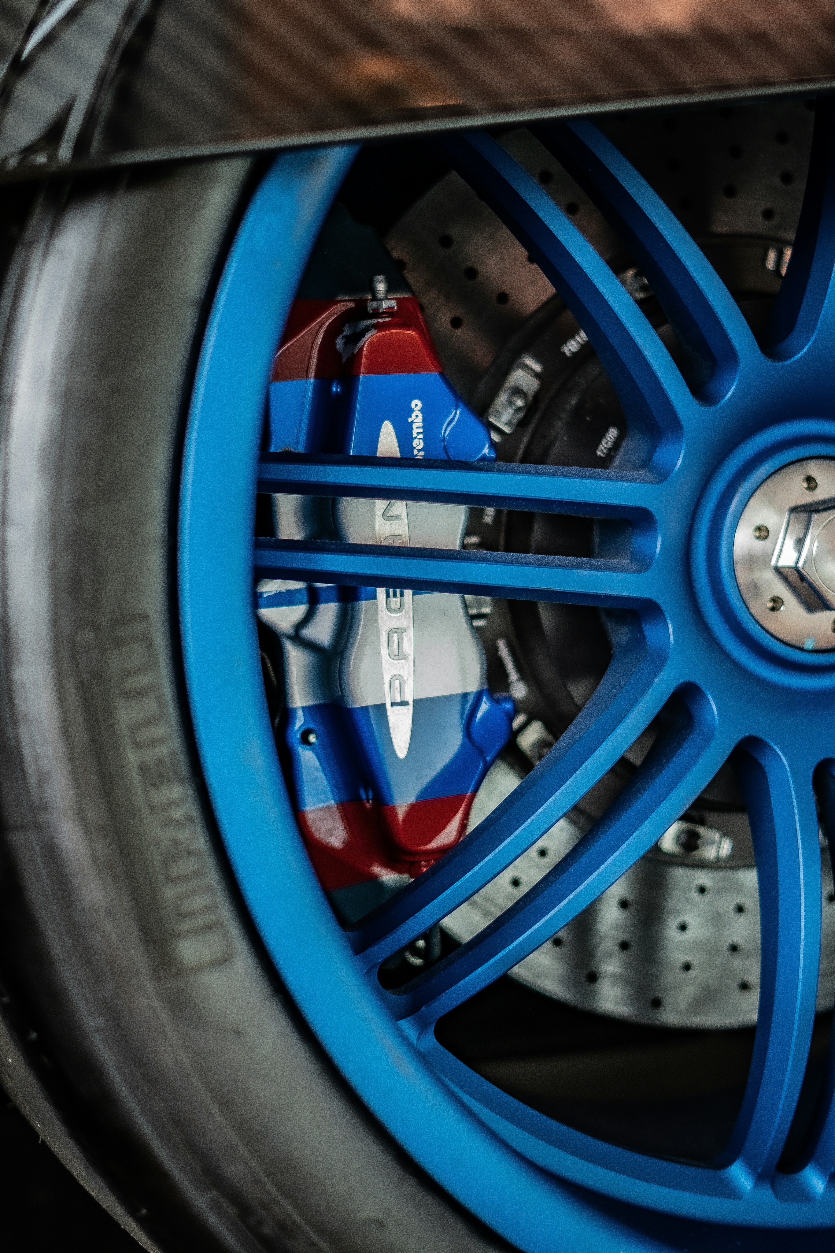A close up of a blue wheel on a sports car photo – Free Blue Image on ...