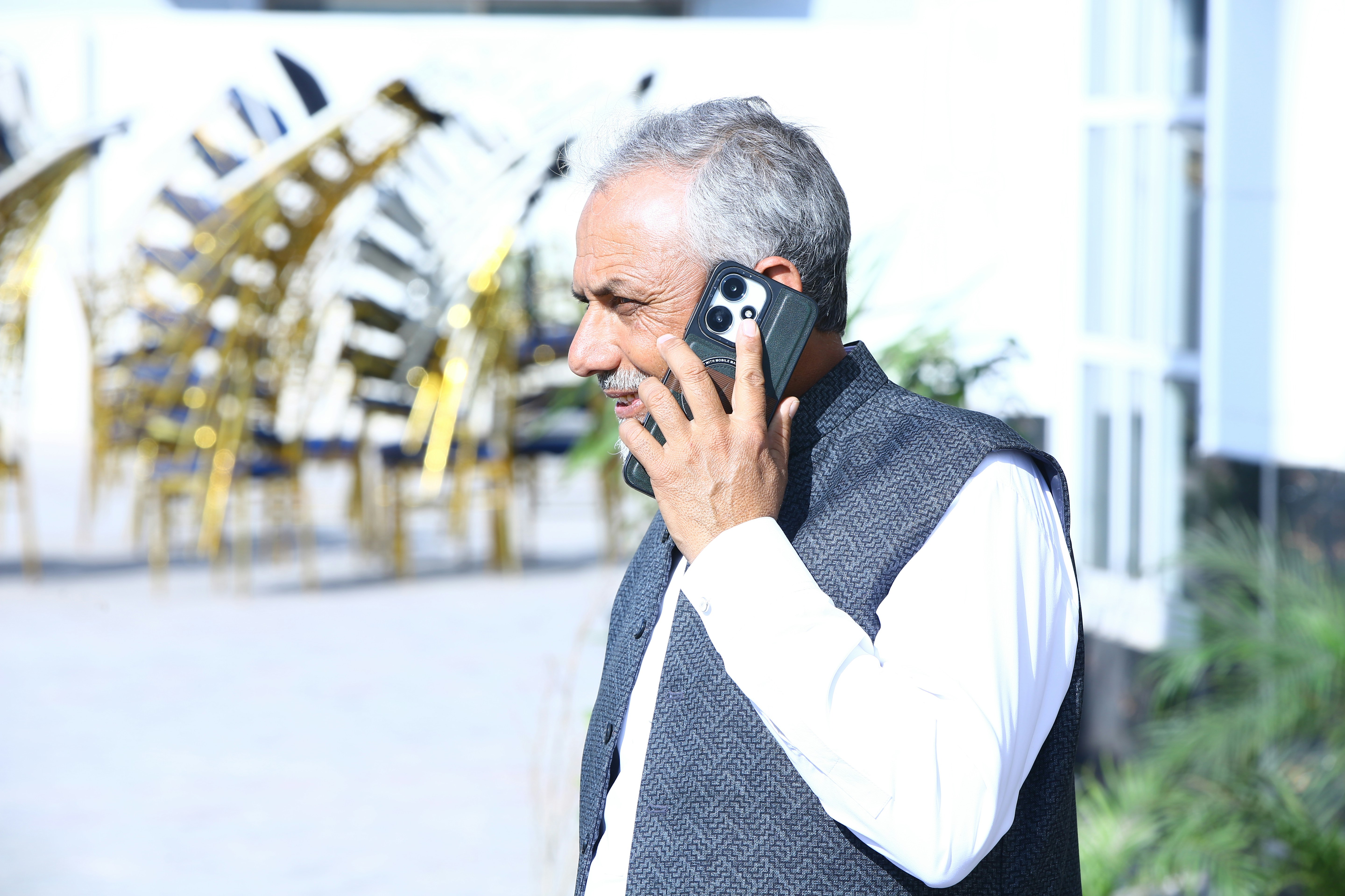 Prime Minister Modi on a phone call, looking serious and engaged in a diplomatic conversation