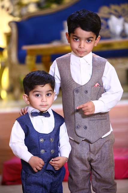 Two young boys standing next to each other