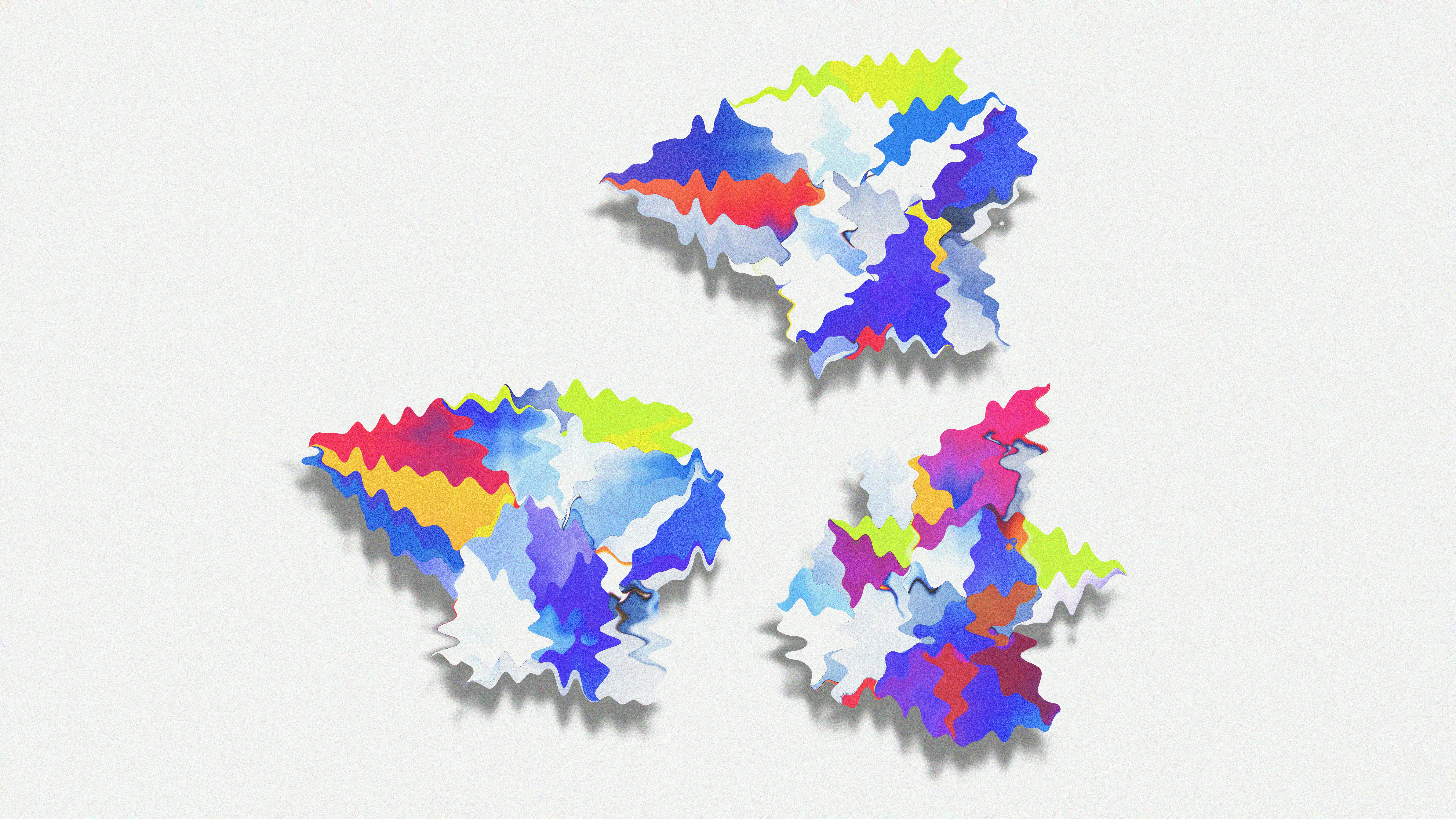 A group of colorful pieces of paper on a white background