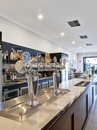 A bar with a bunch of bottles on it