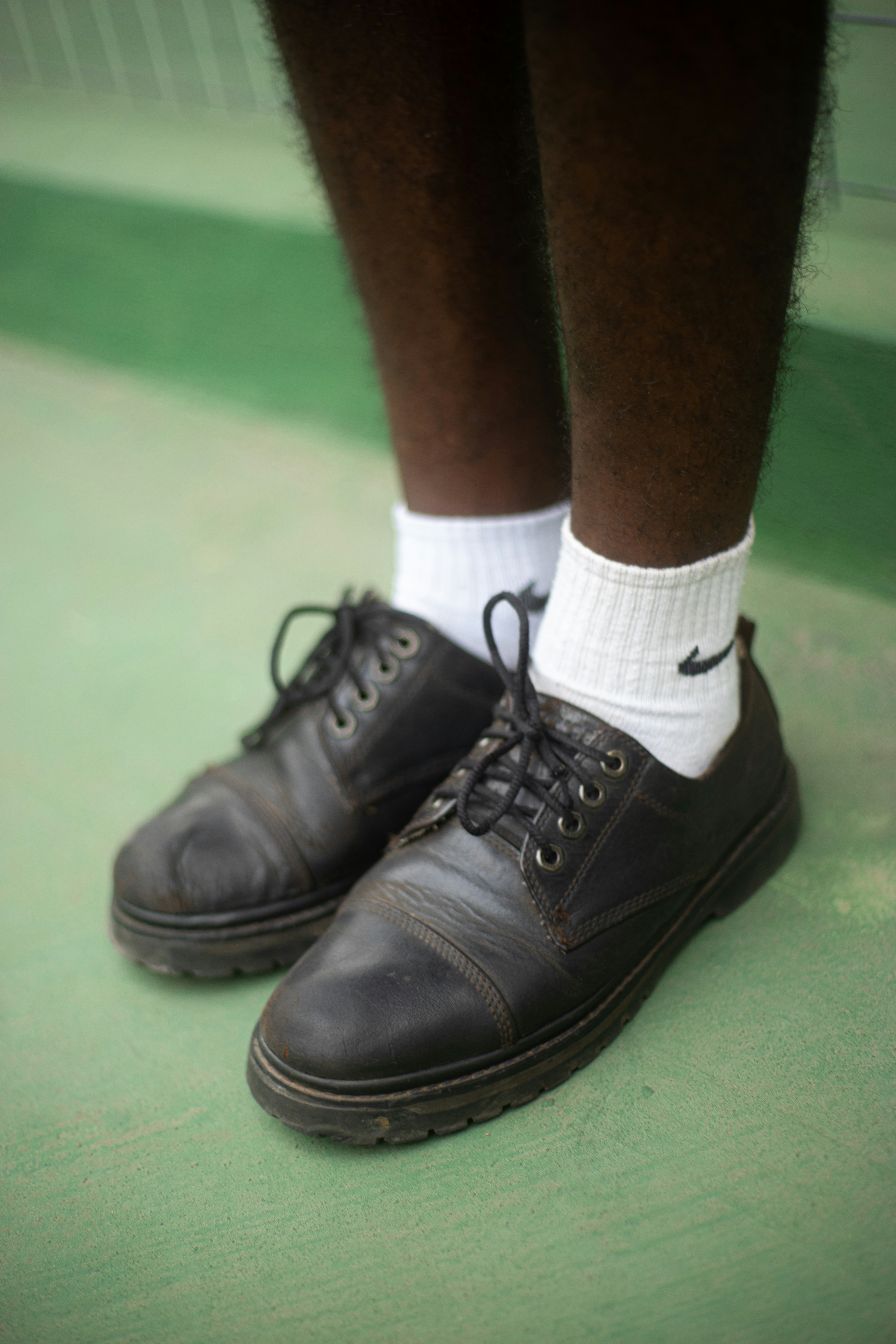 A close up of a person wearing a pair of shoes