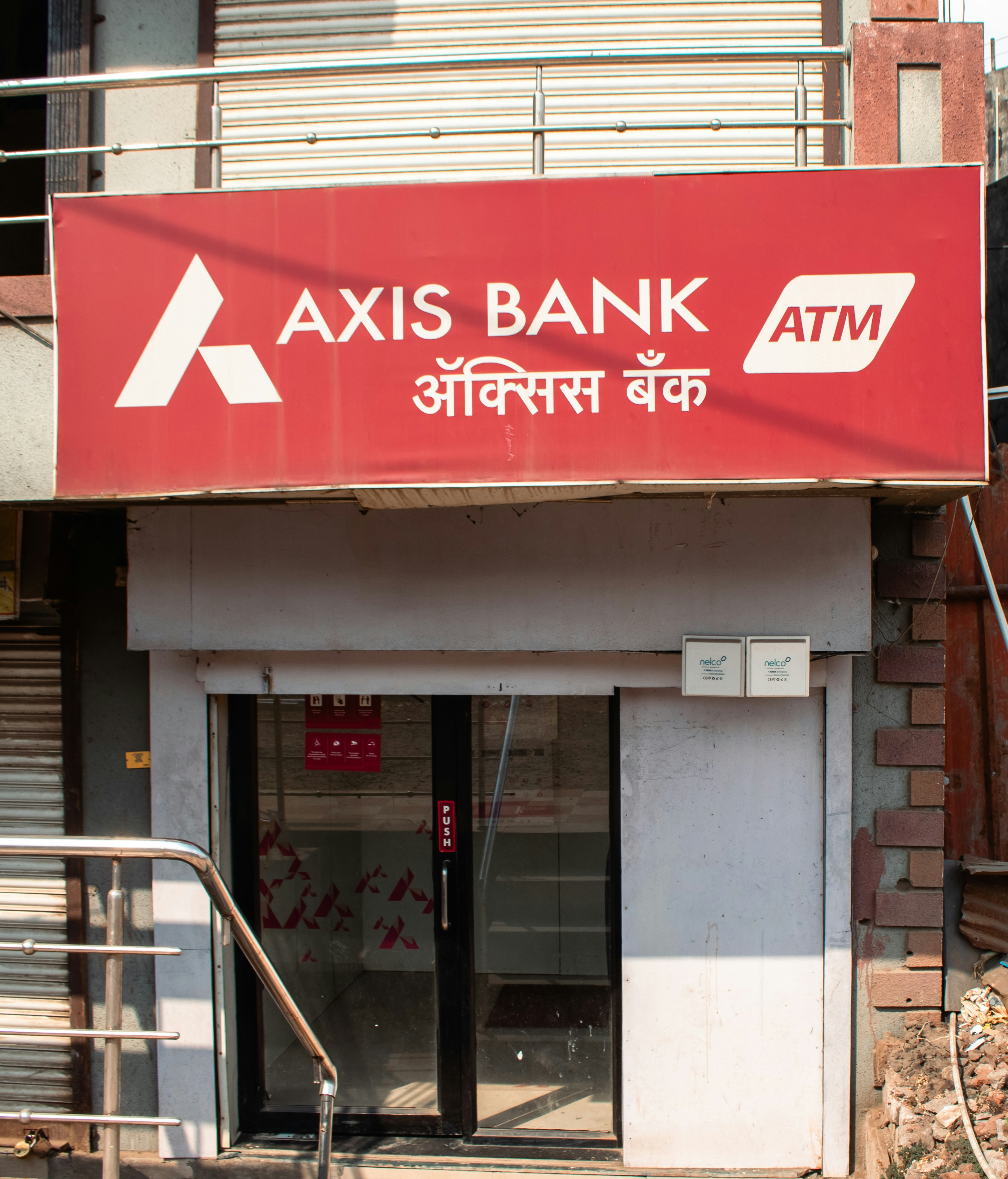 In Kamshet, Pune, Maharashtra, there is an Axis Bank ATM in a building that is rather empty.