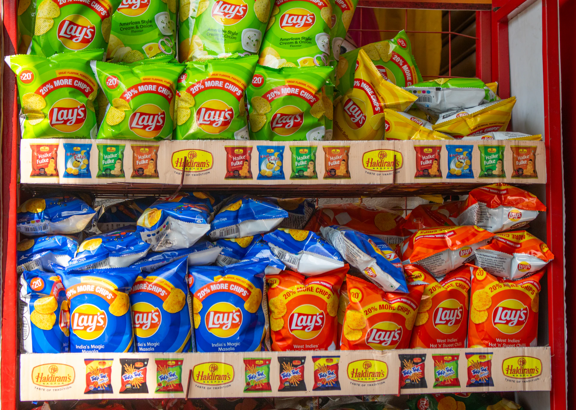 A shelf filled with lots of different types of food