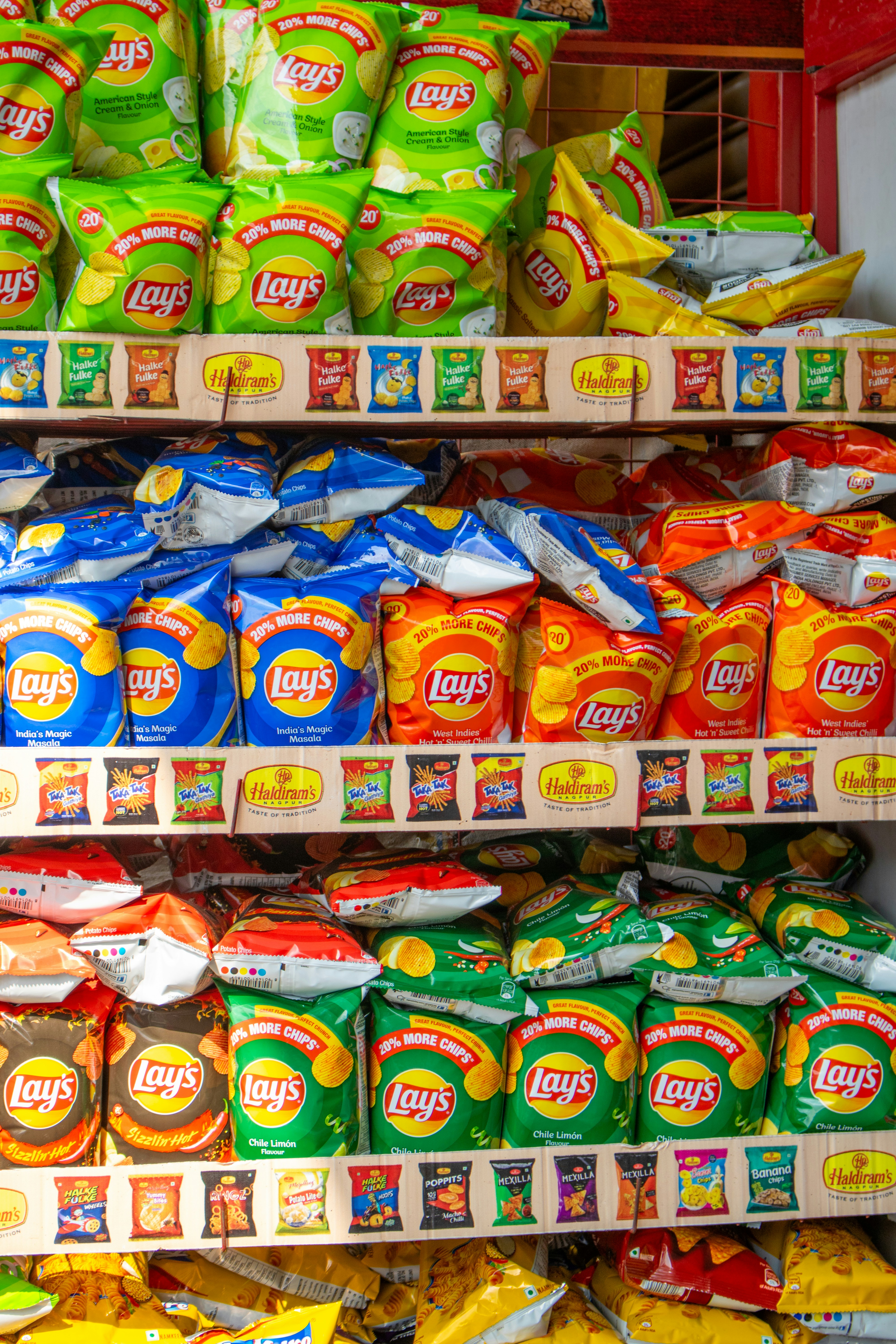 A shelf filled with lots of different types of food