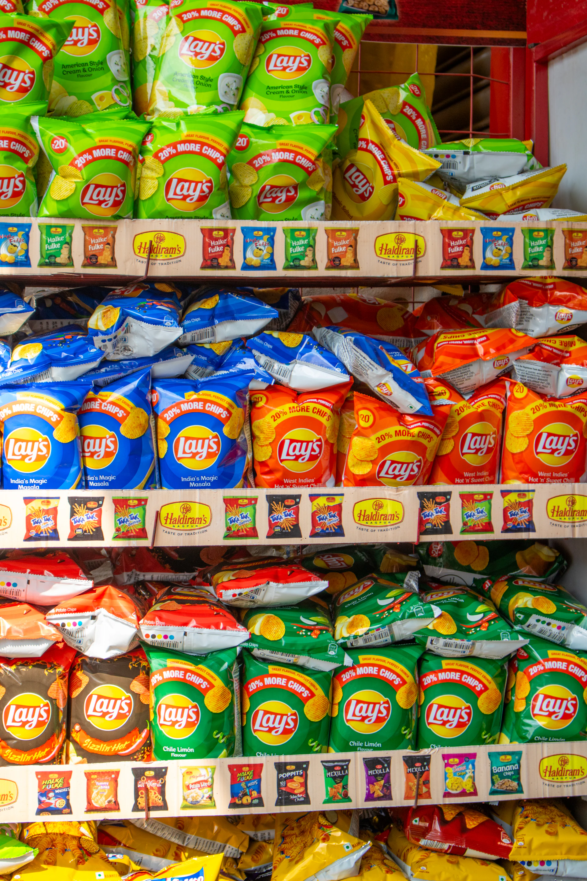A shelf filled with lots of different types of food