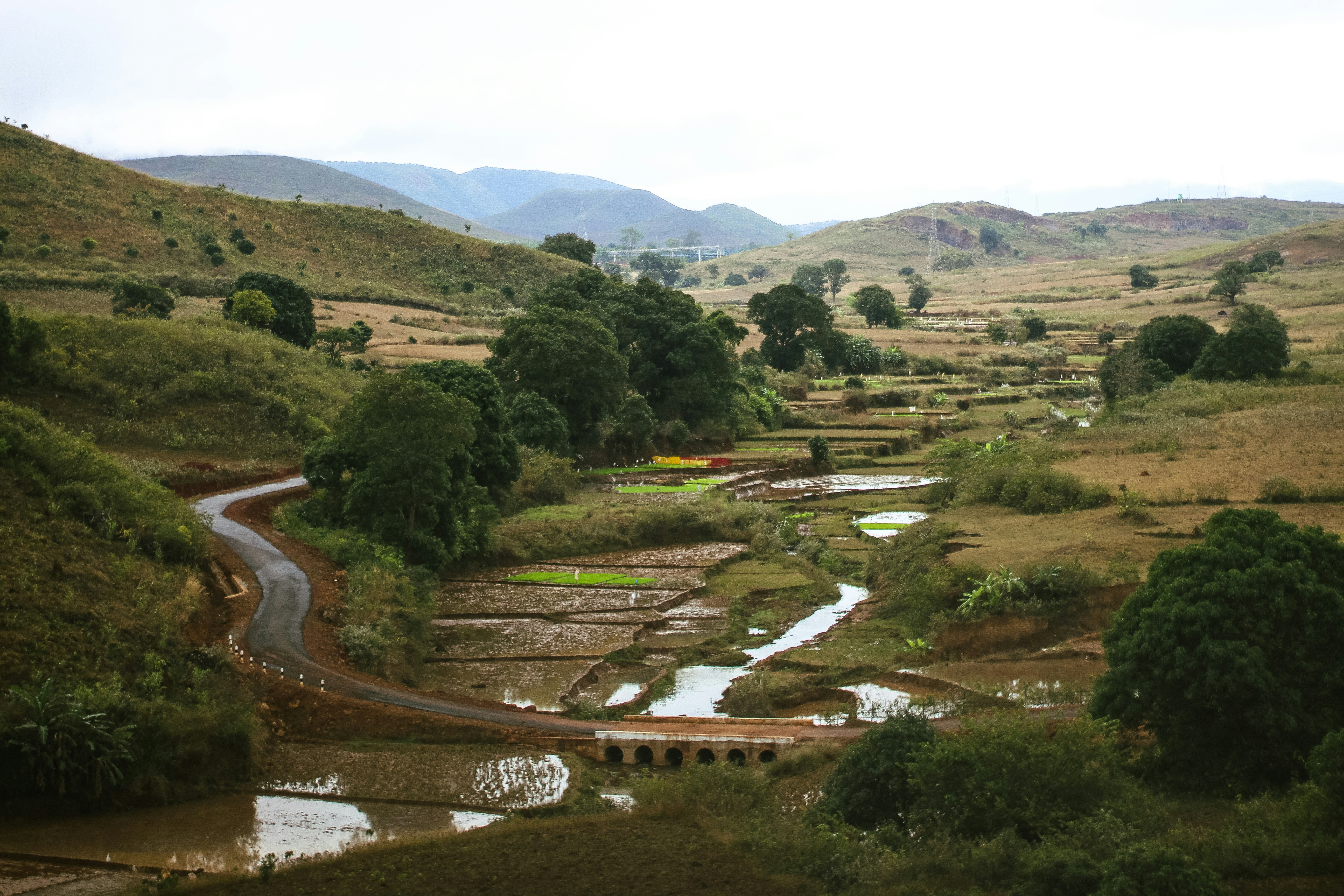 A river running through a lush green valley