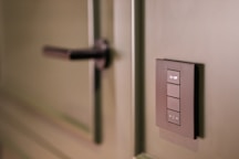 A close up of a light switch on a wall