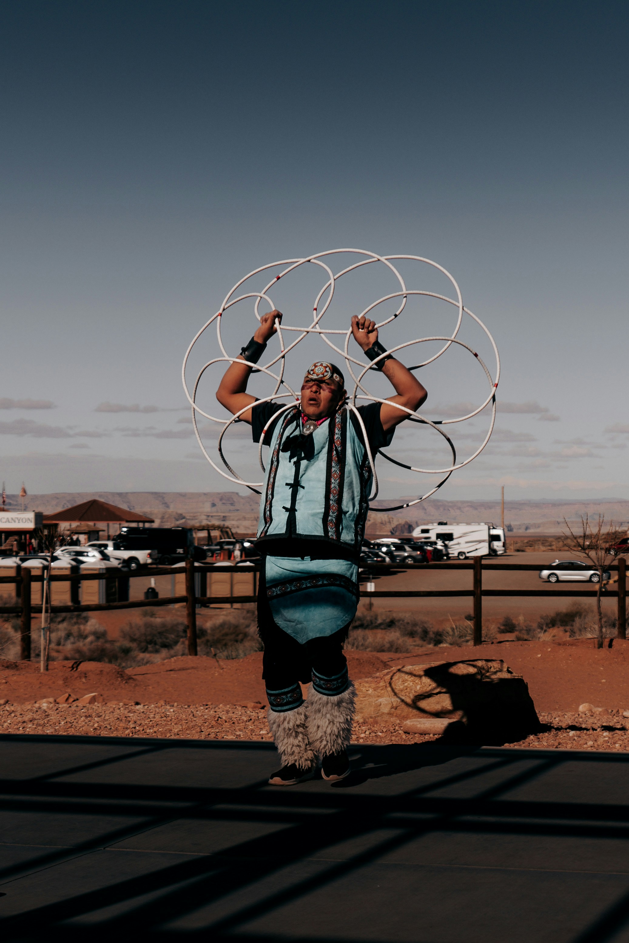 A man holding a large metal object in his hands