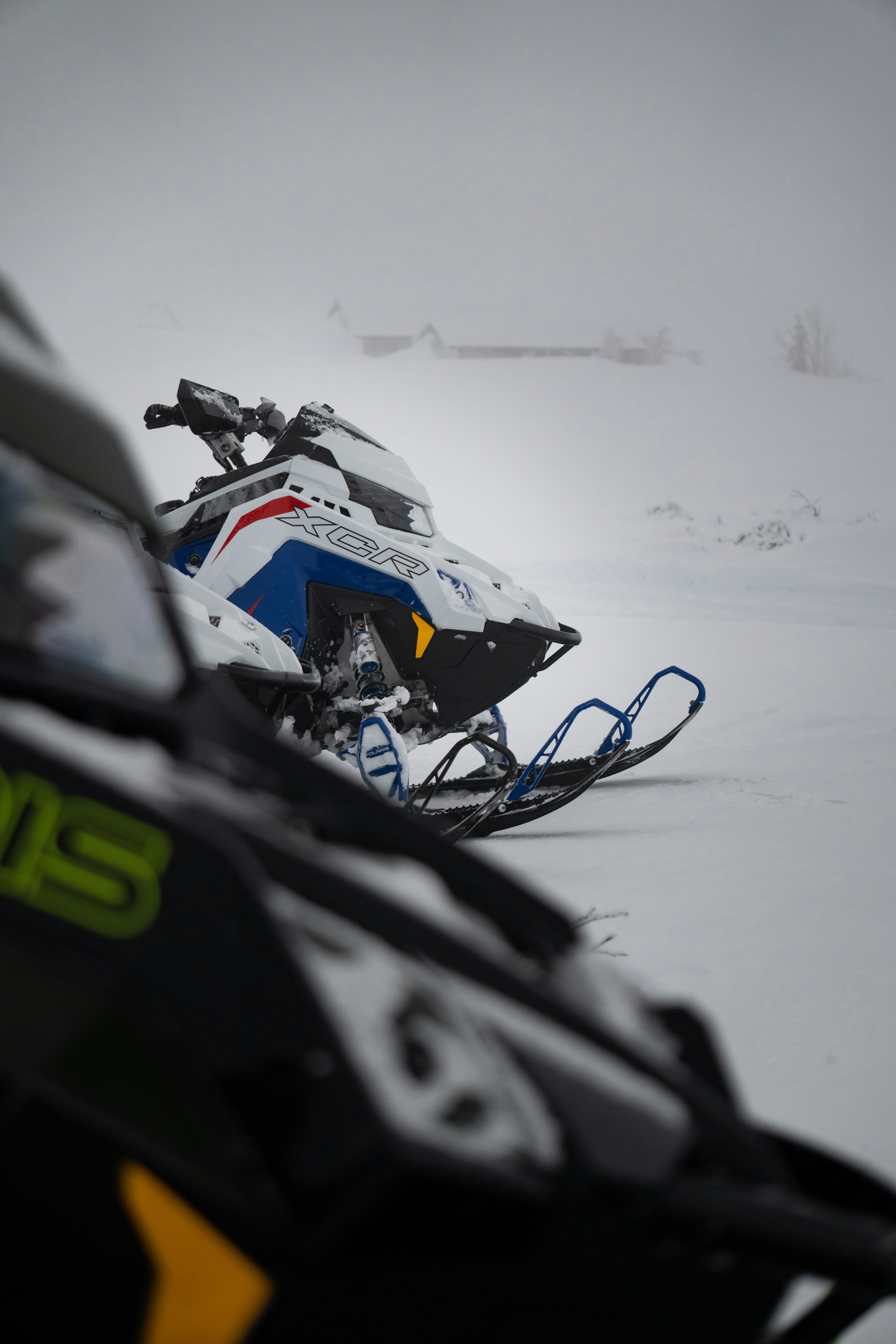 A snowmobile and a snowmobile in the snow photo – Free Winter Image on ...
