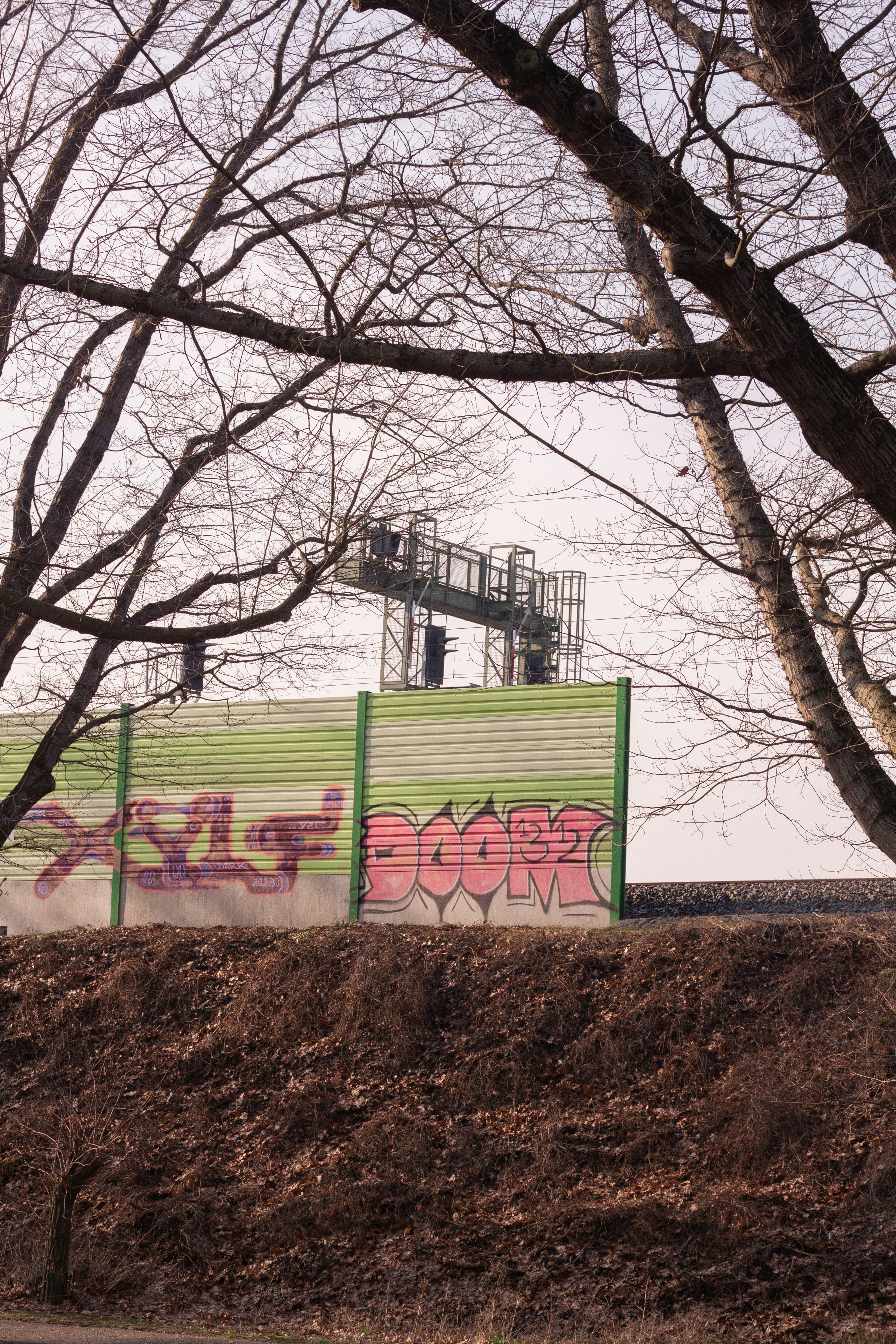 A green box sitting on the side of a road