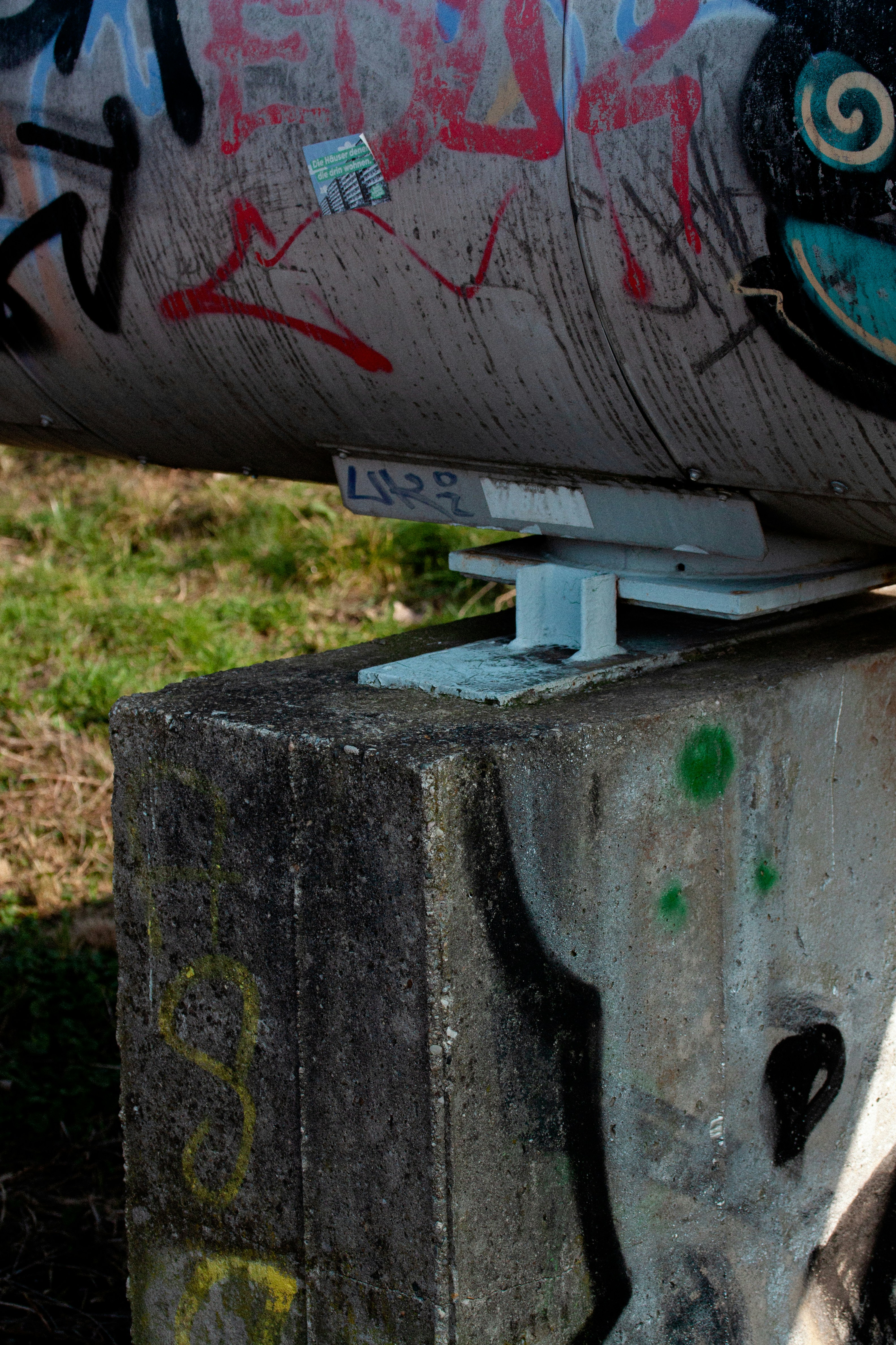 A skateboard that is sitting on top of a cement block