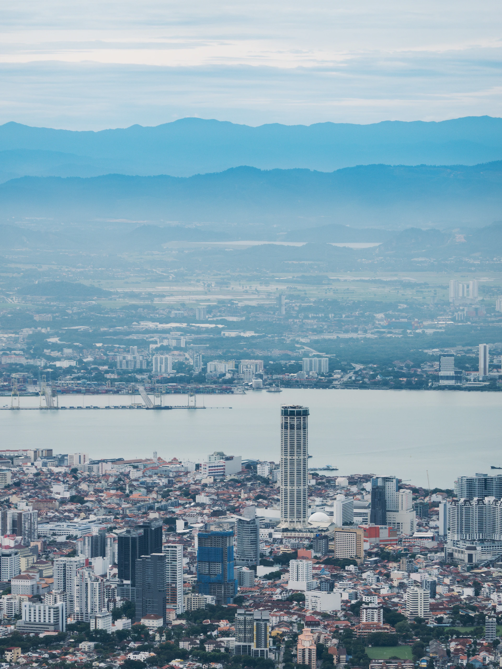 A view of a city with mountains in the background