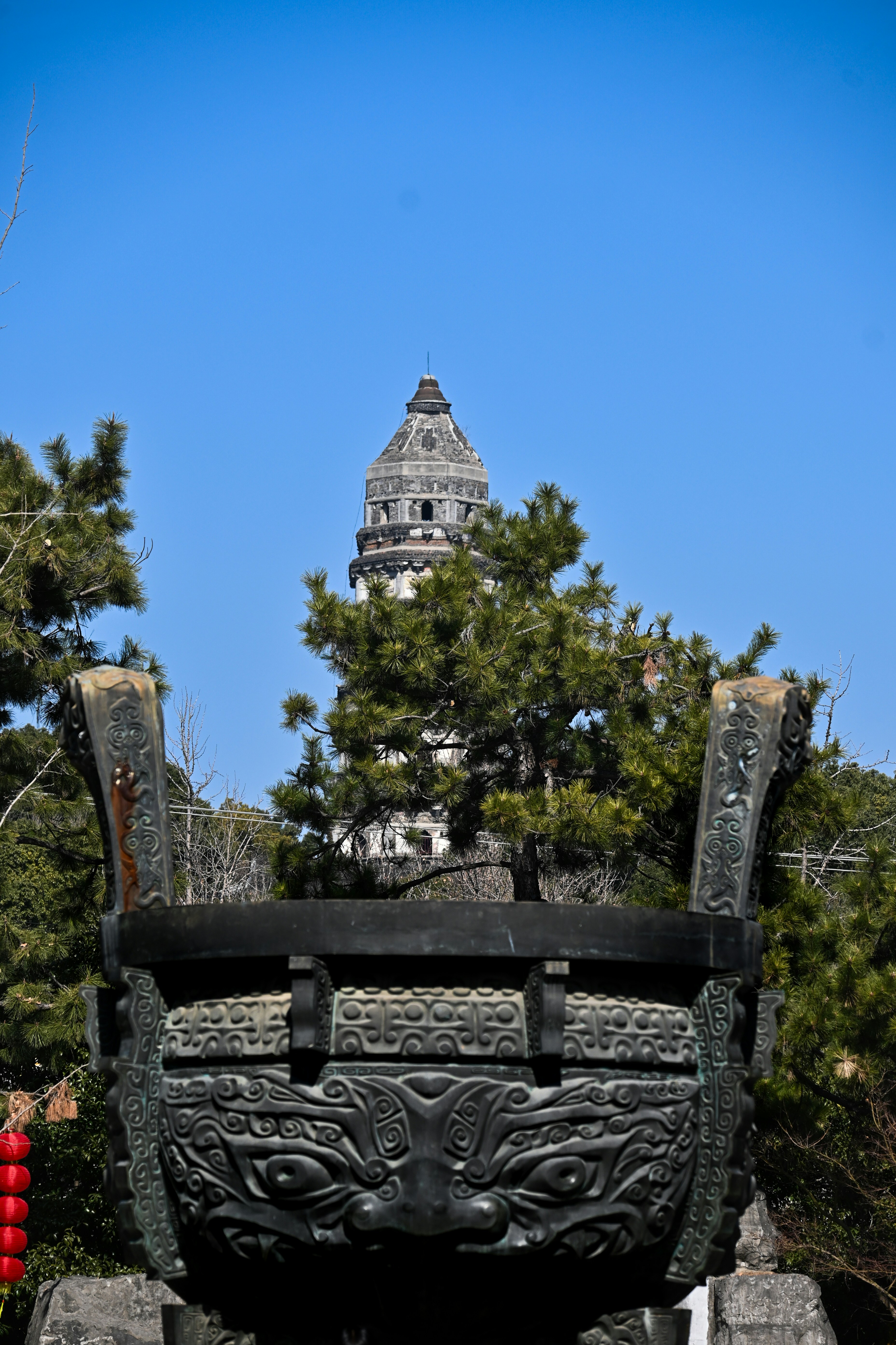 A statue of a bench in front of a building