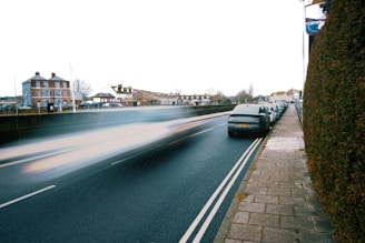 A blurry photo of cars driving down a street