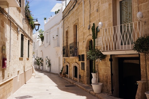 A narrow street with a few buildings on both sides