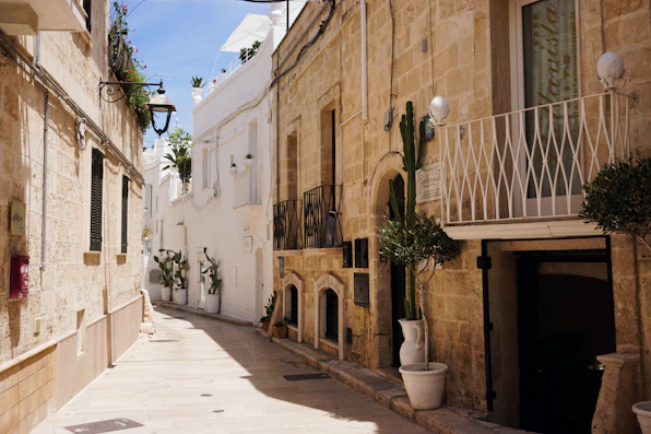 A narrow street with a few buildings on both sides