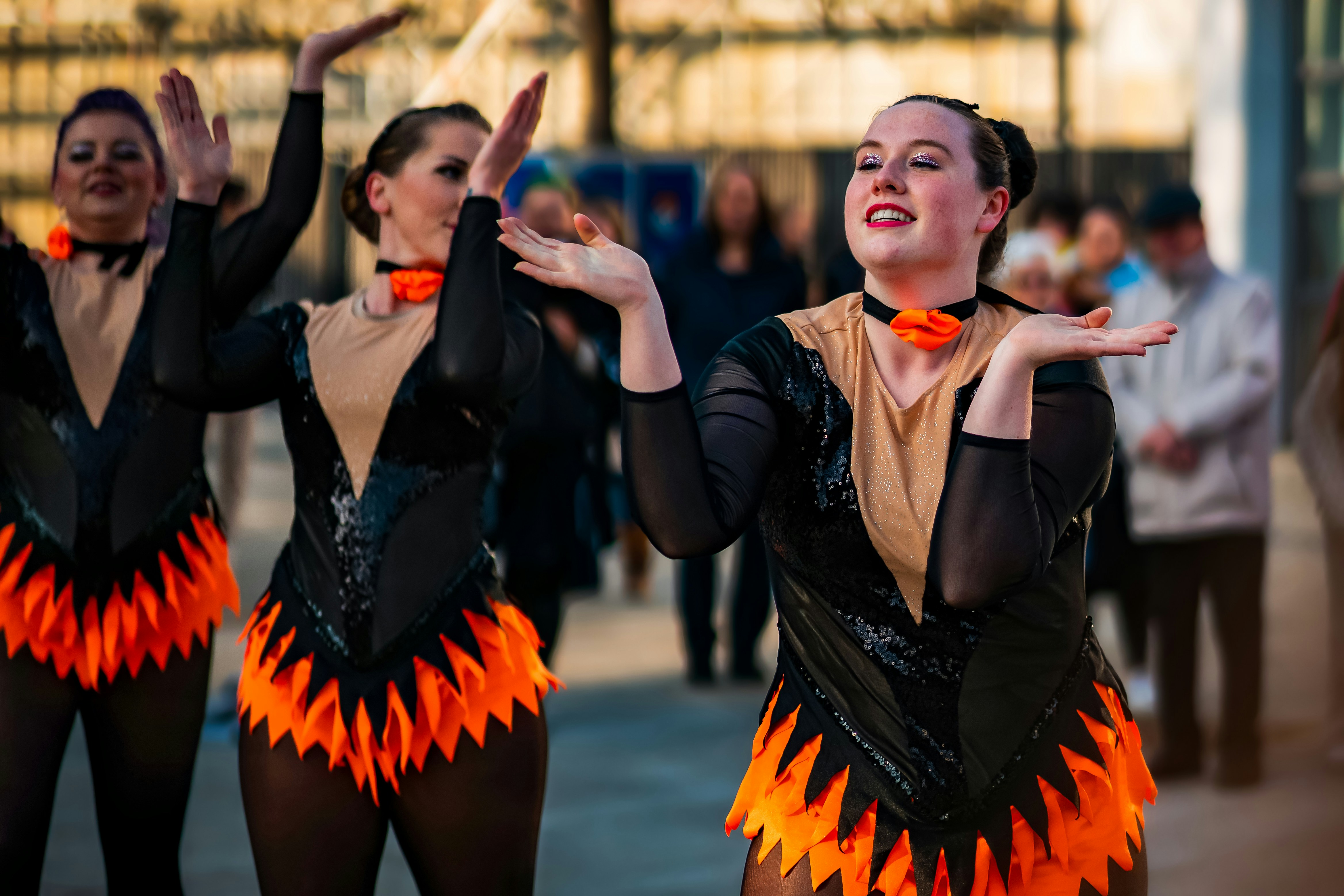 A group of people that are standing in the street