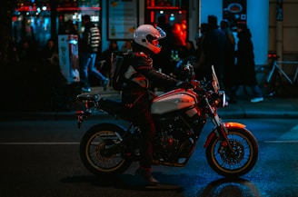 A person riding a motorcycle on a city street