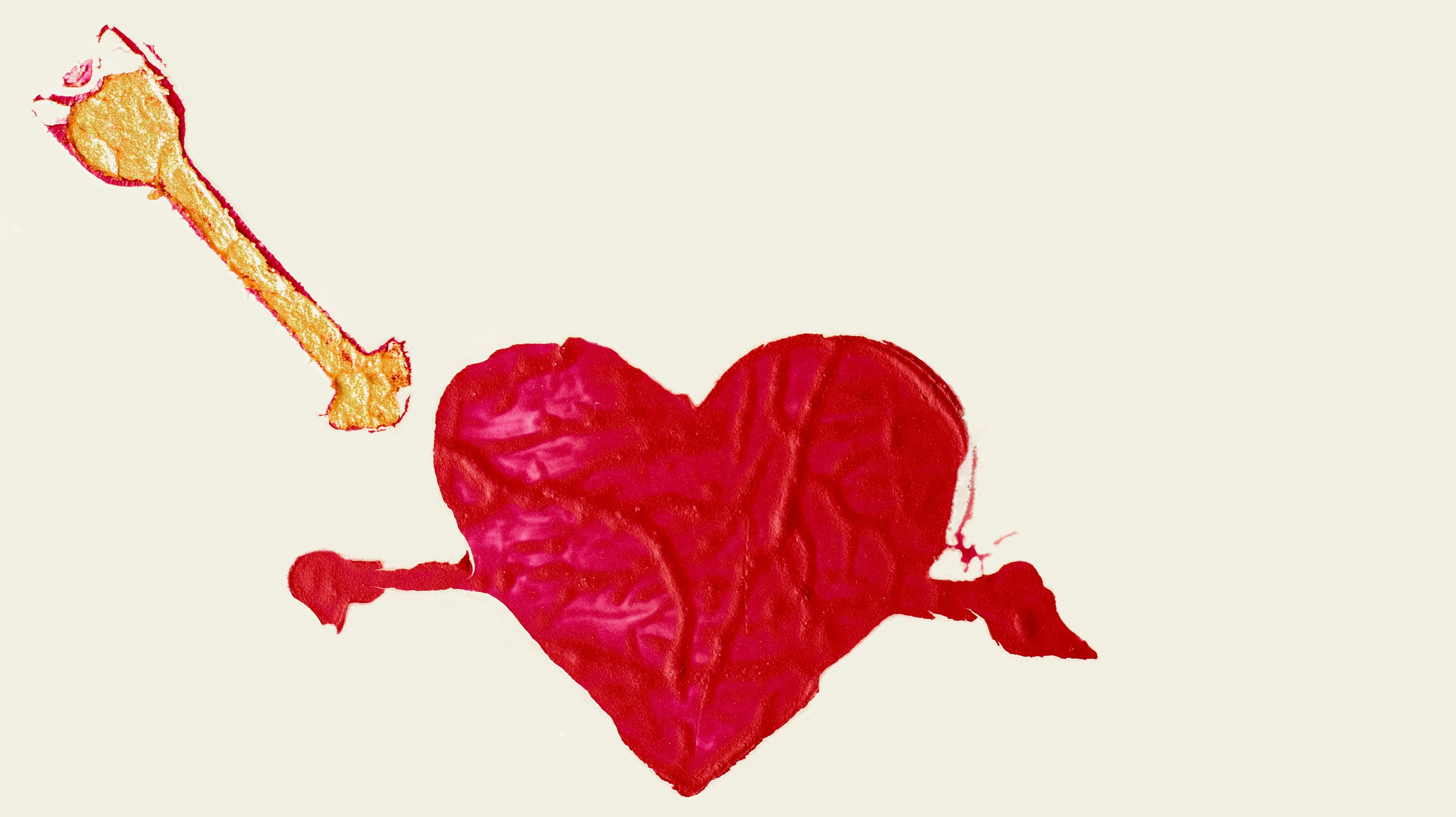 A red heart with a bone sticking out of it