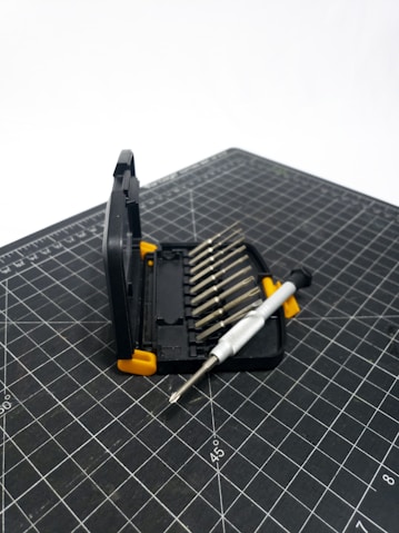 A tool is laying on a cutting mat
