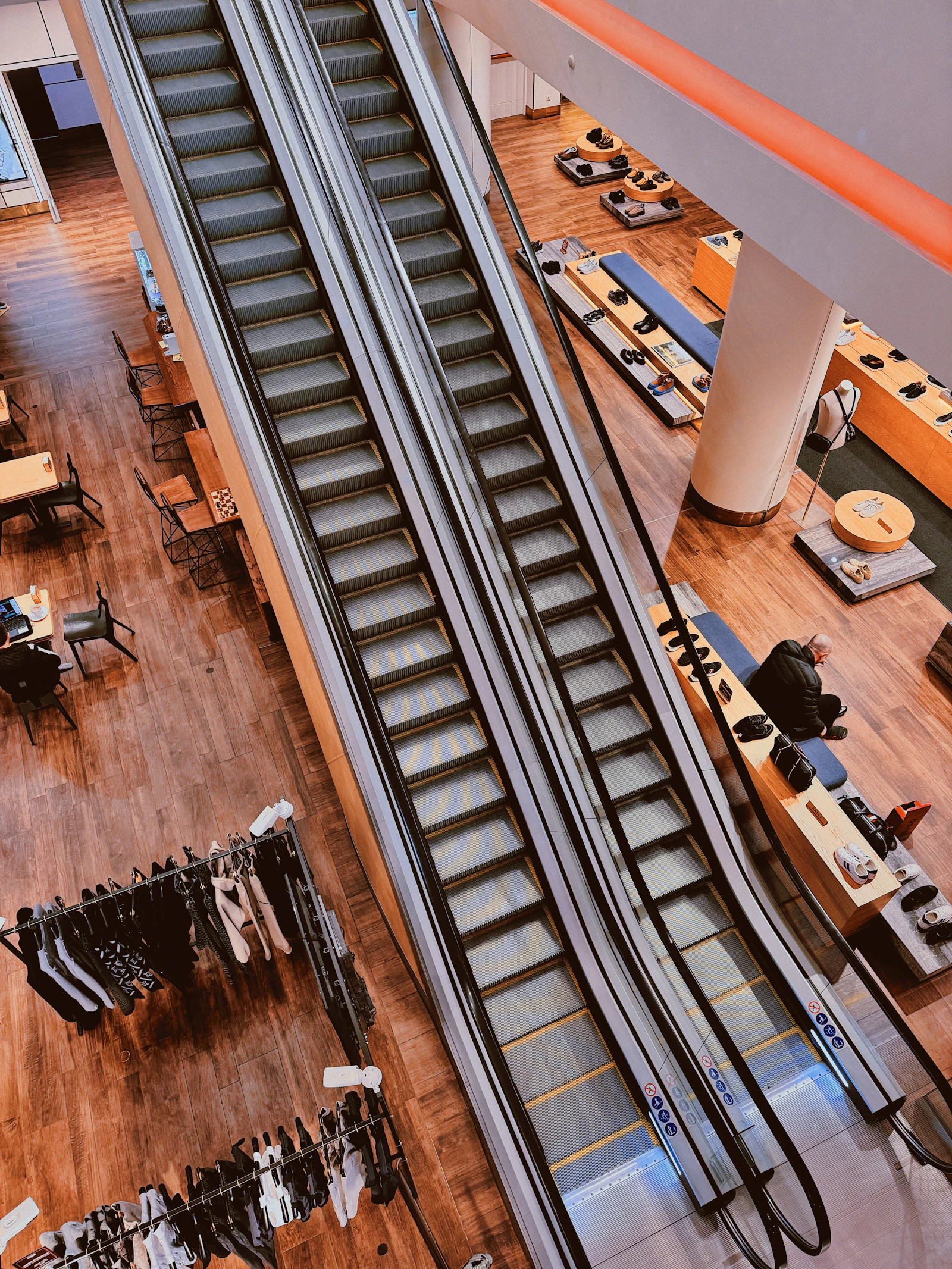 Shopping mall atrium with escalators, the kind of indoor hub Ontario Mills is known for