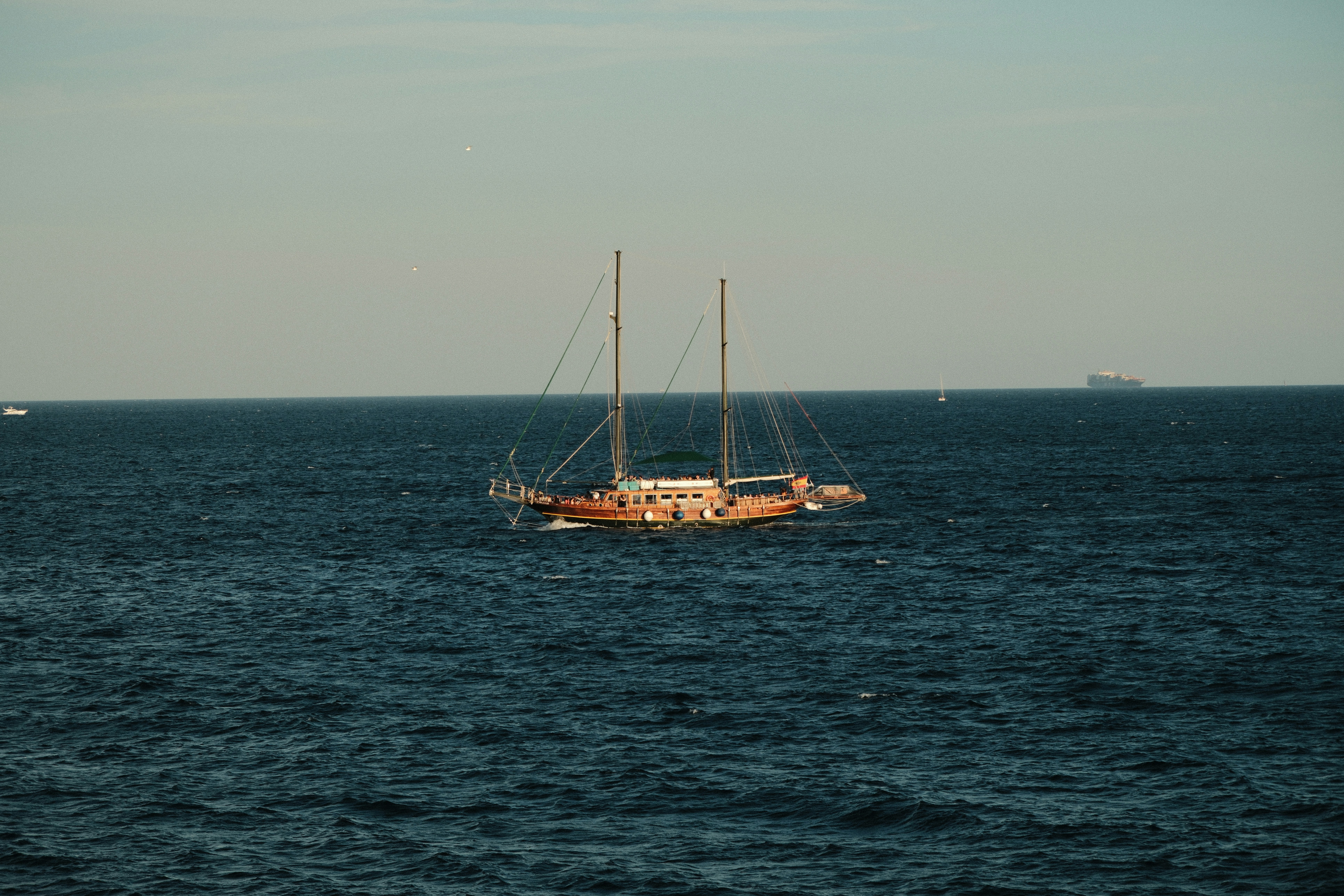 A sailboat in the middle of the ocean