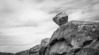 A black and white photo of a rock formation