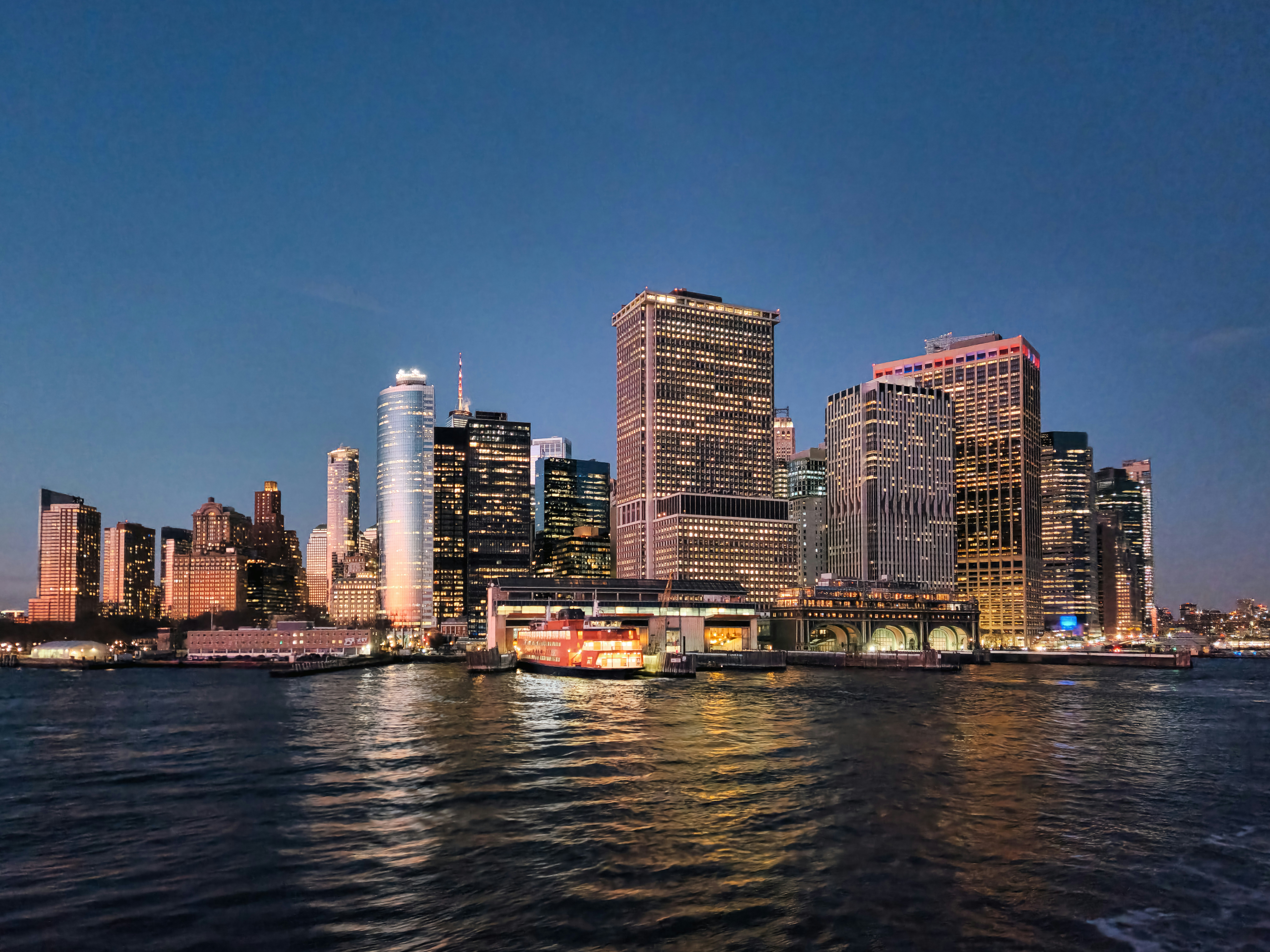 A large body of water with a city in the background