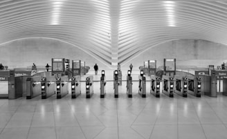 A black and white photo of a train station