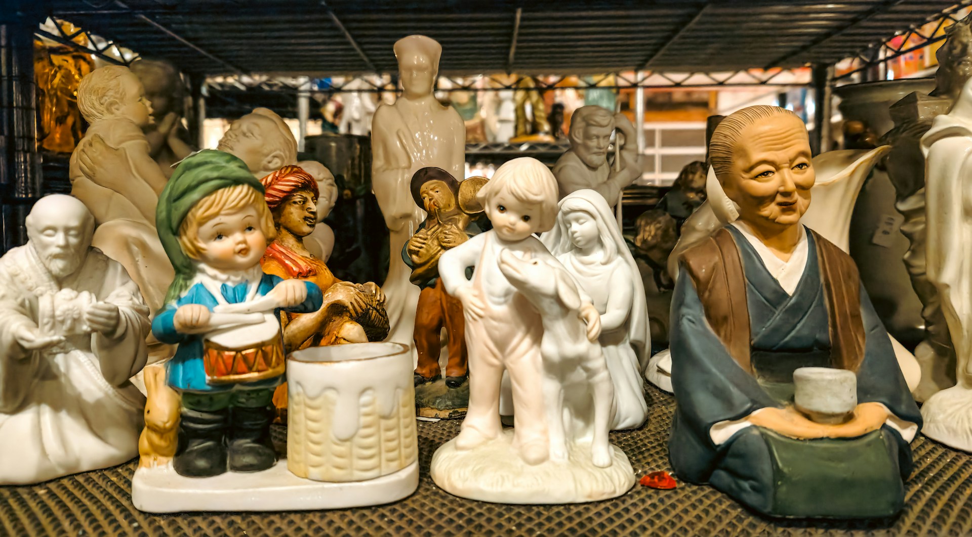 A group of ceramic figurines sitting on top of a table