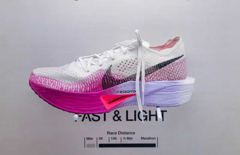 pair of Nike shoes displayed on a wall