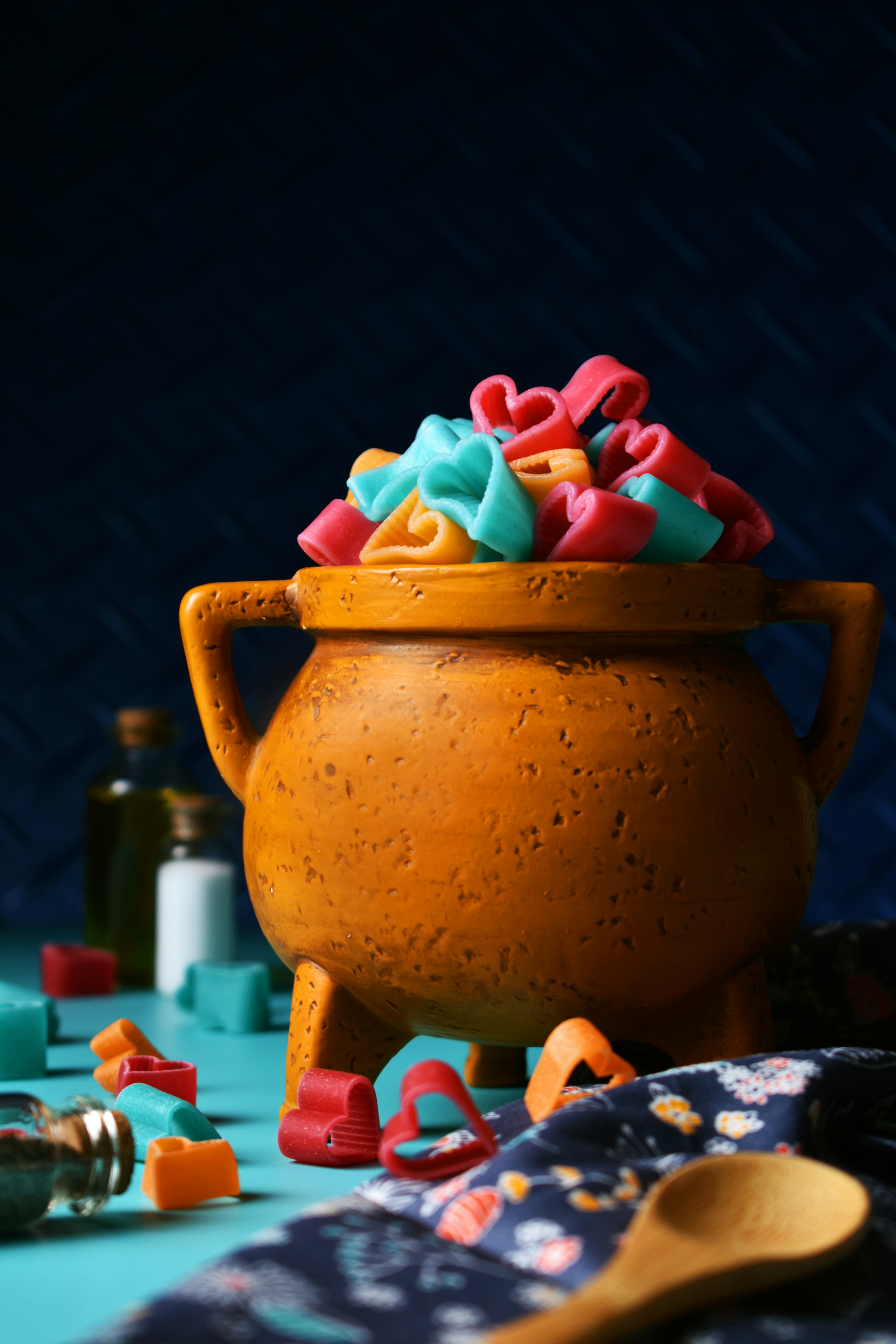 A clay pot filled with lots of colorful candy