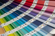 A bunch of different colors of paint on a table