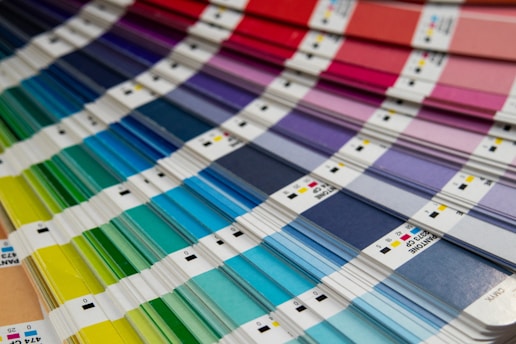 A bunch of different colors of paint on a table