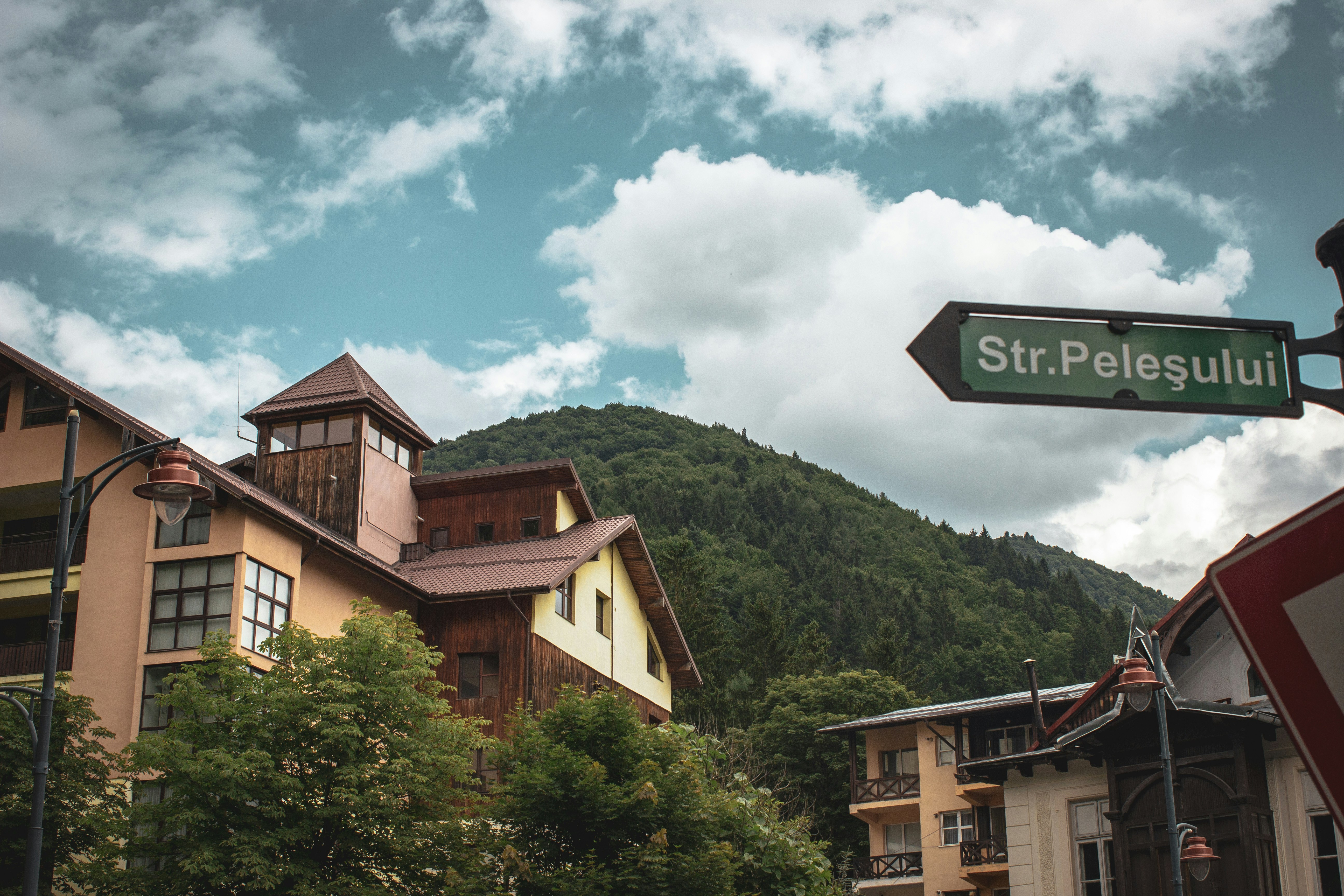 A street sign in front of a row of buildings