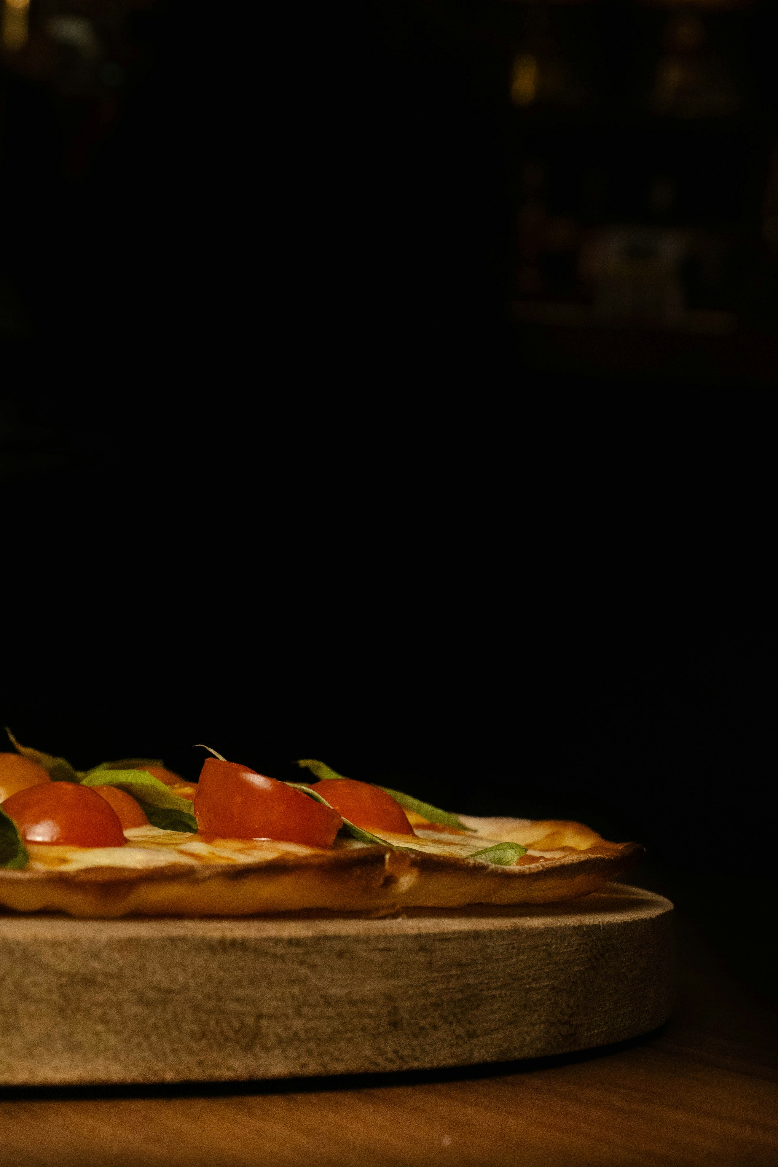 A pizza sitting on top of a wooden table