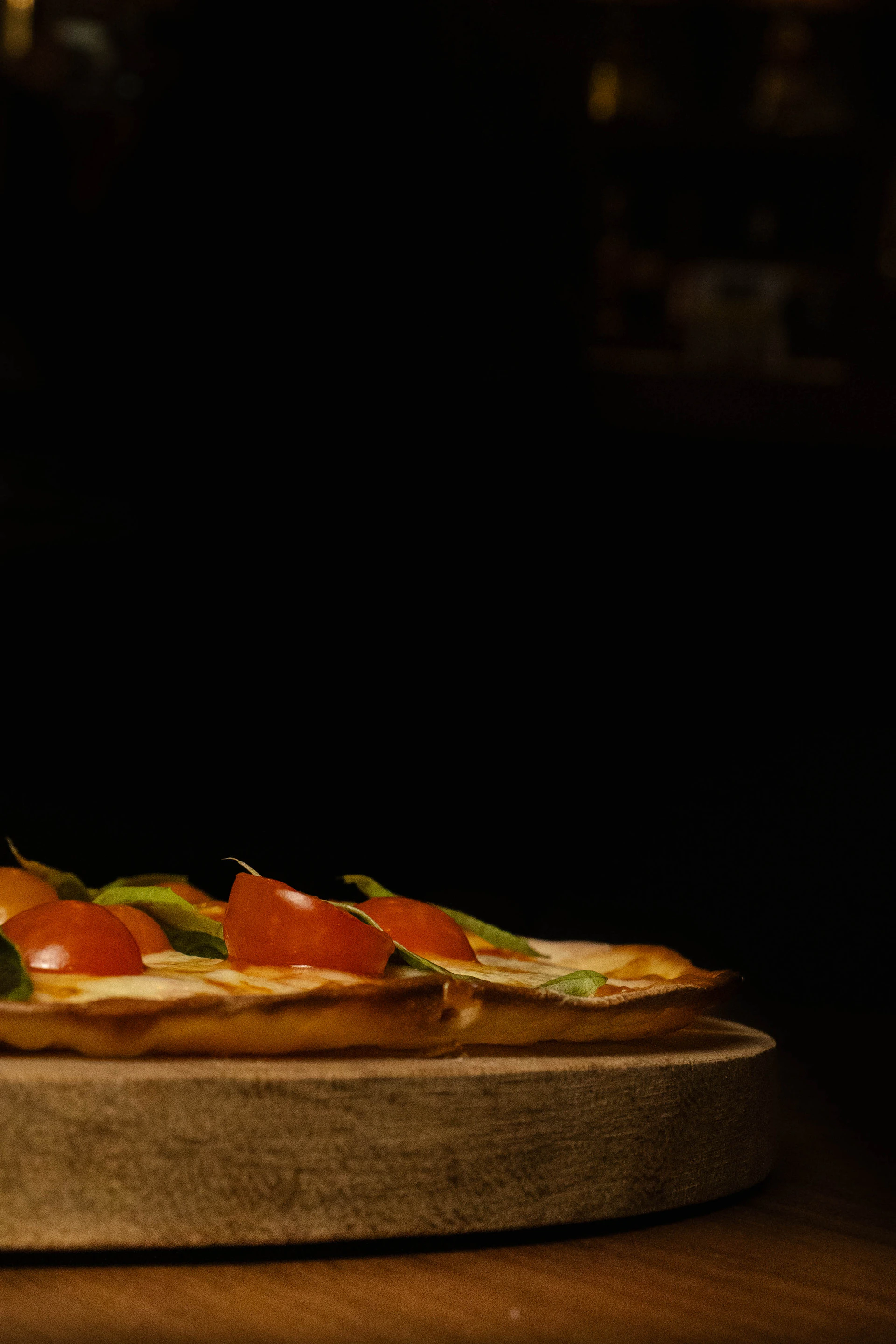 A pizza sitting on top of a wooden table
