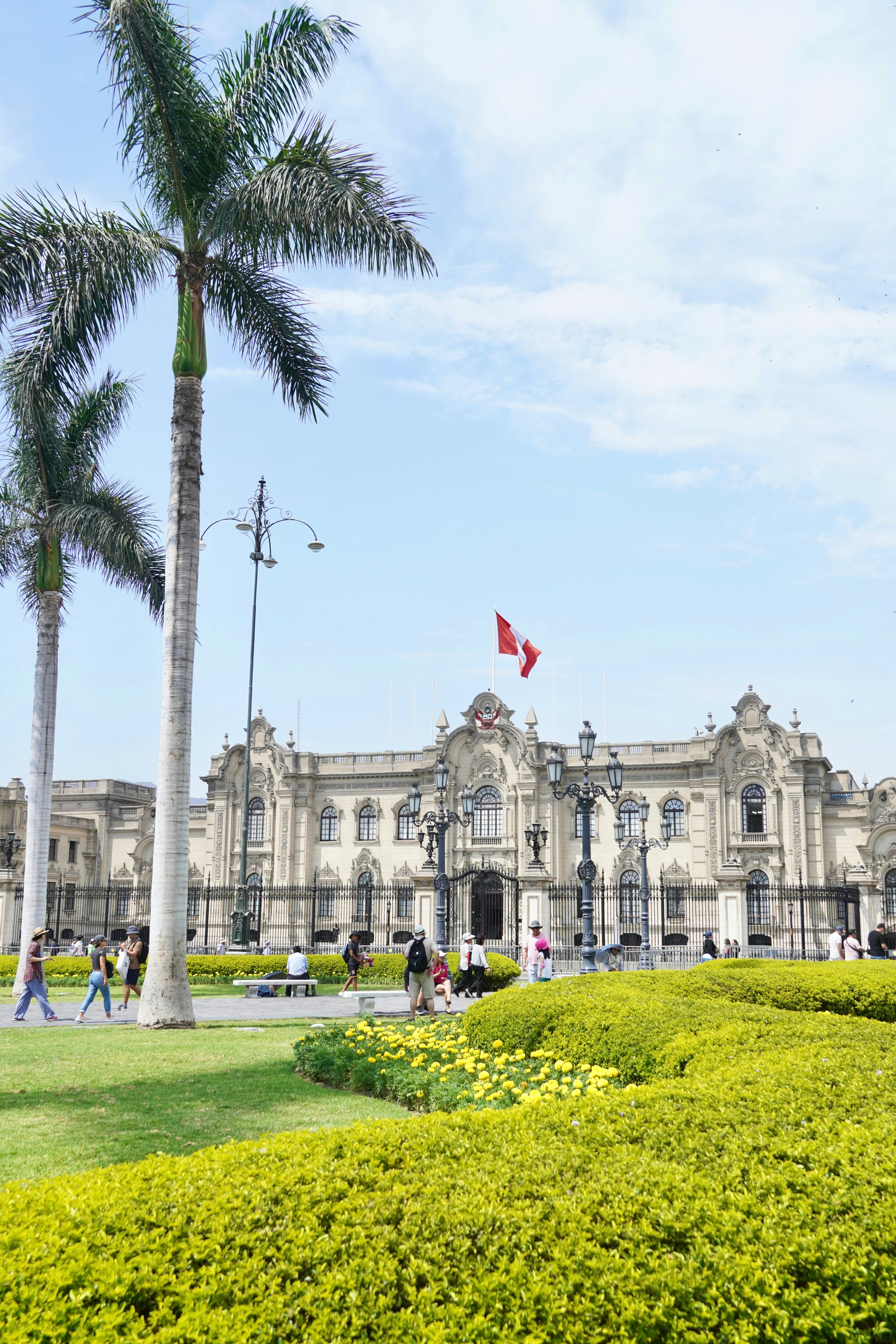 A large building with many trees in front of it