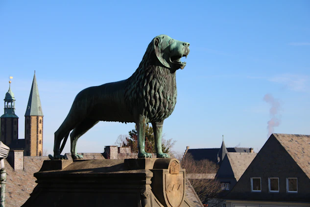 A statue of a dog on top of a building